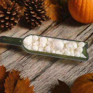 Green Glass Bottle with White Wax Skulls